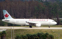 C-FTJS @ MCO - Air Canada A320 taxies over the inter-terminal connecting bridge at Orlando Int - by Terry Fletcher