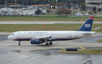 N663AW @ TPA - US Airways A320 taxying to depart Tampa