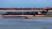 N221PS @ PHL - US Airways CRJ arrives Philadelphia just before dusk - by Terry Fletcher