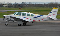N8258F @ EGBJ - A visitor to Gloucestershire Airport on the day of the horse racing Gold Cup  at the nearby Cheltenham Racecourse - by Terry Fletcher