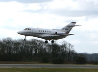 CS-DNU @ EGGW - Netjets Hawker 800XP about to land at Luton in dull weather - by Terry Fletcher