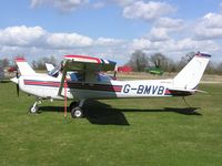 G-BMVB @ EGTN - Cessna 152 sitting in the sun at Enstone - by Simon Palmer