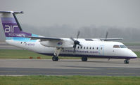 G-WOWD @ EGCC - Southwest Dash 8 arriving at Manchester - by Terry Fletcher