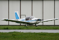 F-GBCR @ LFPL - Parked in the grass in front of the maintenance hangar - by Shunn311