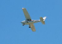 N301CF @ SIG - 2002 Cessna 172R Skyhawk, c/n 17281135, In the traffic pattern at SIG, taken from the beach/pool area from my hotel the Caribe Hilton - by Timothy Aanerud