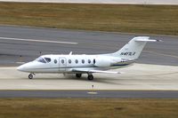 N417LX @ CID - Options 417 taxiing on Alpha after landing Runway 27