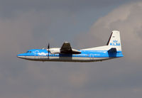PH-LXT @ EGSH - KLM Fokker 50 climbs away from Norwich UK - one of the few scheduled flights from this East Anglian City - by Terry Fletcher