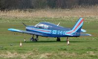 G-BCGI @ EGCB - Piper PA-28-140 parked remotely  at a waterlogged  Barton - by Terry Fletcher