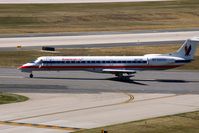 N671AE @ CID - Take-off roll on Runway 13 - by Glenn E. Chatfield