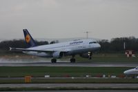 D-AIQD @ EGCC - Taken at Manchester Airport on a typical showery April day - by Steve Staunton