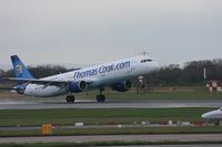 G-DHJH @ EGCC - Taken at Manchester Airport on a typical showery April day - by Steve Staunton
