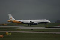 G-OZBG @ EGCC - Taken at Manchester Airport on a typical showery April day - by Steve Staunton