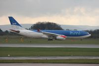 G-WWBM @ EGCC - Taken at Manchester Airport on a typical showery April day - by Steve Staunton