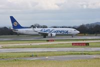 5B-DBU @ EGCC - Taken at Manchester Airport on a typical showery April day - by Steve Staunton