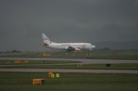 G-TOYJ @ EGCC - Taken at Manchester Airport on a typical showery April day - by Steve Staunton