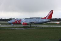 G-CELU @ EGCC - Taken at Manchester Airport on a typical showery April day - by Steve Staunton