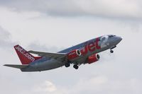 G-CELU @ EGCC - Taken at Manchester Airport on a typical showery April day - by Steve Staunton