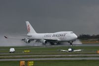 B-KAI @ EGCC - Taken at Manchester Airport on a typical showery April day - by Steve Staunton