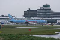 G-BYAW @ EGCC - Taken at Manchester Airport on a typical showery April day - by Steve Staunton