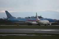 G-OBYJ @ EGCC - Taken at Manchester Airport on a typical showery April day - by Steve Staunton