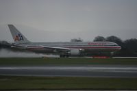 N39356 @ EGCC - Taken at Manchester Airport on a typical showery April day - by Steve Staunton