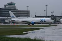 G-VKNI @ EGCC - Taken at Manchester Airport on a typical showery April day - by Steve Staunton