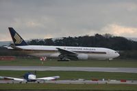 9V-SVC @ EGCC - Taken at Manchester Airport on a typical showery April day - by Steve Staunton