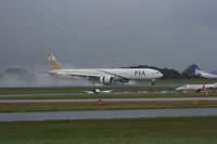 AP-BID @ EGCC - Taken at Manchester Airport on a typical showery April day - by Steve Staunton