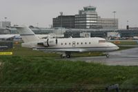 VP-CFT @ EGCC - Taken at Manchester Airport on a typical showery April day - by Steve Staunton