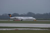 D-ACJJ @ EGCC - Taken at Manchester Airport on a typical showery April day - by Steve Staunton