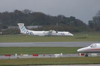 G-JECL @ EGCC - Taken at Manchester Airport on a typical showery April day - by Steve Staunton