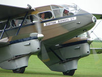 G-AGJG @ EGBK - There looks a wealth of flying experience inside this classic aircraft - by Terry Fletcher