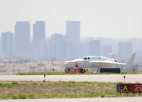 N6LK @ KBJC - Taxi in with Downtown Denver in the distance. - by Bluedharma