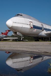 N602PR @ KMEB - ex Northwest Boeing 747 - reflection - by Yakfreak - VAP