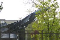 75-0039 @ FFO - F-15A mounted at Wright-Patterson AFB gate.  No photos allowed up close, so this was shot on the road through the trees. - by Glenn E. Chatfield