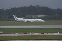 G-ERJD @ EGCC - Taken at Manchester Airport on a typical showery April day - by Steve Staunton