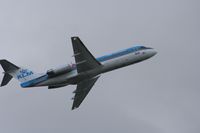 PH-KZM @ EGCC - Taken at Manchester Airport on a typical showery April day - by Steve Staunton