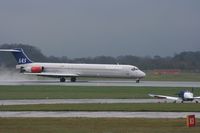 OY-KHG @ EGCC - Taken at Manchester Airport on a typical showery April day - by Steve Staunton
