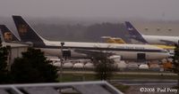 N139UP @ RDU - Chillin on a rainy ramp - by Paul Perry