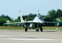 1303 @ EPSN - This tiger coloured MiG-29 taxies in after landing. Note the dragchute still deployed. - by Joop de Groot