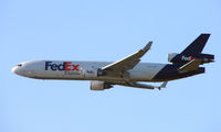 N587FE @ ANC - FedEX MD11 climbs out of Anchorage - by Terry Fletcher