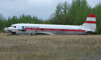 N82FA @ ENN - This damaged DC-4 is well hidden from view at Neana Municipal , Alaska - by Terry Fletcher