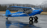 N14303 @ SWD - A colourful Piper-18-150 on a wet Seward day - by Terry Fletcher
