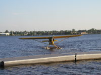 N98781 @ KDYT - Taxiing in to tie up to the dock. - by Mitch Sando