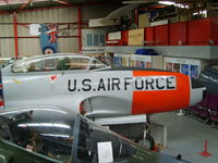 51-4419 @ EGBE - Lockheed T-33A displayed inside the main, but cramped hangar - by chrishall