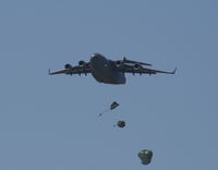 93-0599 @ MCF - C-17 dropping parachutes - by Florida Metal