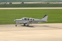 N260EA @ CID - Taxiing to Runway 27 for departure. - by Glenn E. Chatfield