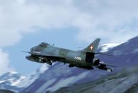 J-4050 @ LSMJ - Turtmann was situated in the heart of the Alps. After take off the aircraft had to make a steep climb out of the Rhone valley. This Hunter carries two large bombs underneath the wings, making the aircraft even less manouvrable. - by Joop de Groot