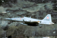 J-3058 @ LSMJ - After take off the F-5 stays well low when it passes the village of Turtmann. What about jet noise..?