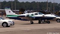 N14MW @ NKT - Team Oracle's plane on the hot ramp - by Paul Perry